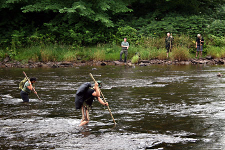 Students crossing the river