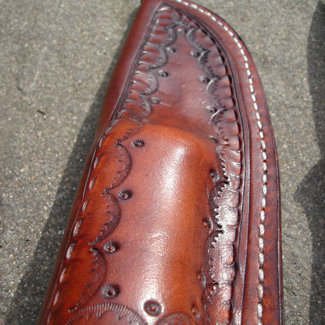 A close-up of Stan's leather stamping