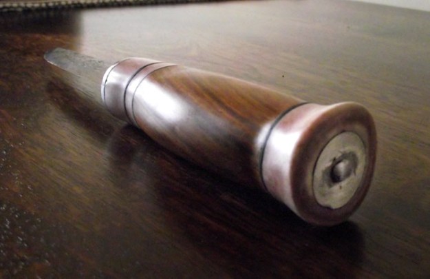 The end of the handle, showing the six pence coin Joshua included in his design