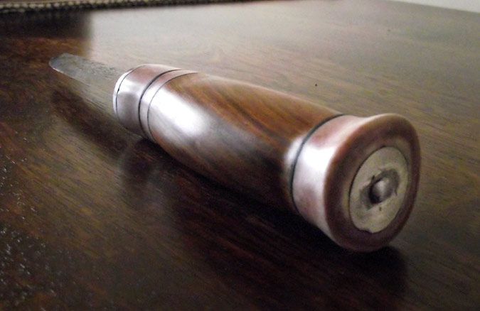 The end of the handle, showing the six pence coin Joshua included in his design