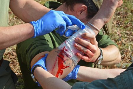 Dressing a wound during a first aid scenario