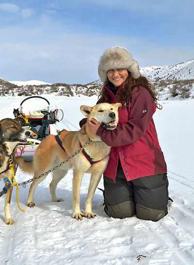Thalia in Canada with one of her lead sledding dogs, Gomer
