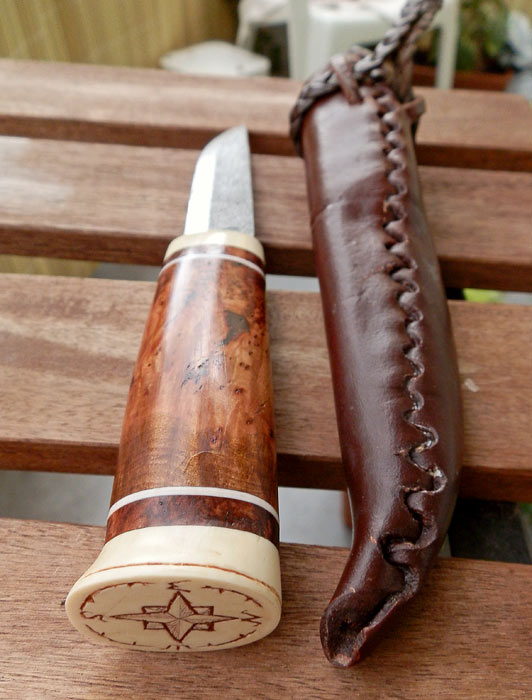 Chris' knife, complete with scrimshaw compass design
