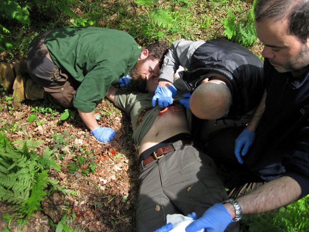 Students rush to the aid of a gunshot wound victim on the WEM2