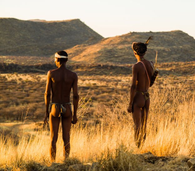 San bushmen gaze over the wilderness